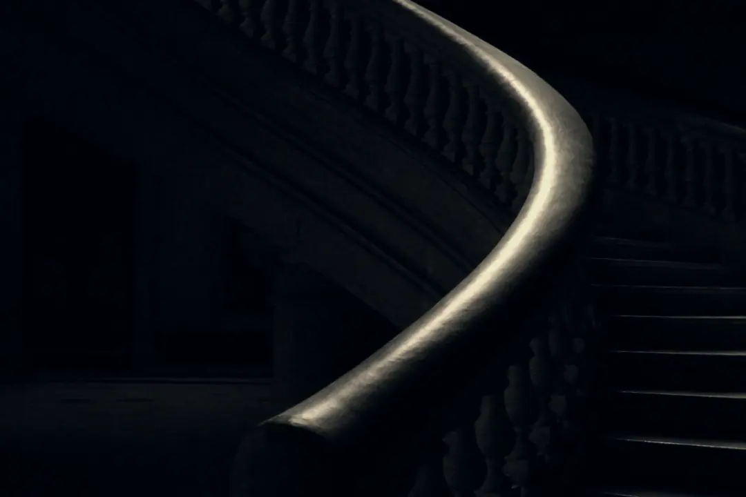 Curved banister in raking light